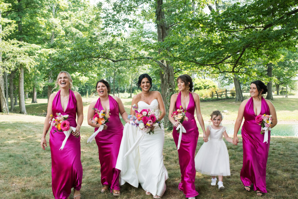 Bridesmaids posing during a summertime wedding in Loveland, Ohio