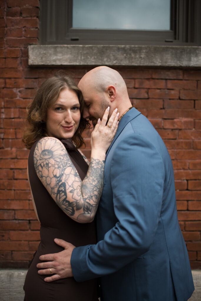 A couple posing in  Printer's Alley