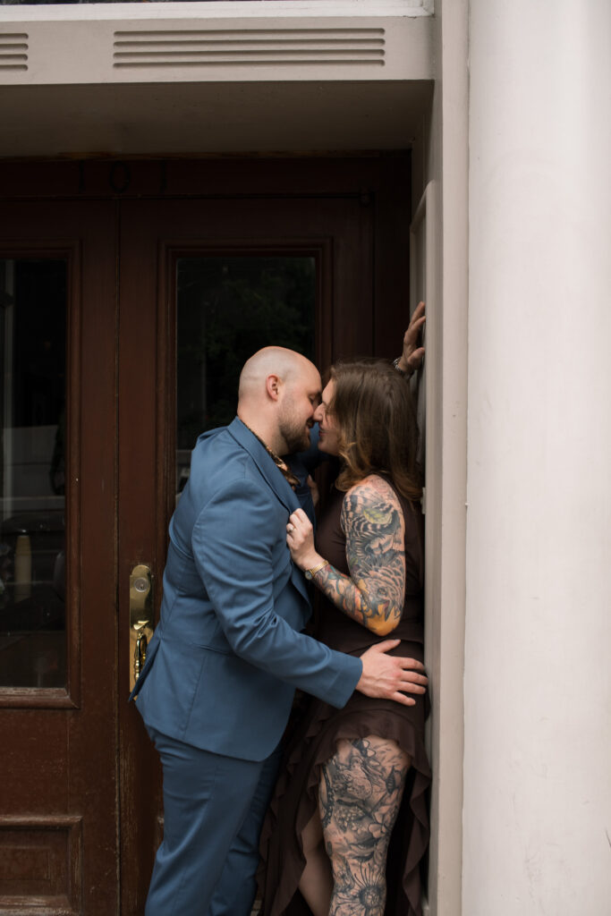 A couple kissing in a doorway in Printer's Alley in Nashville, Tennessee 