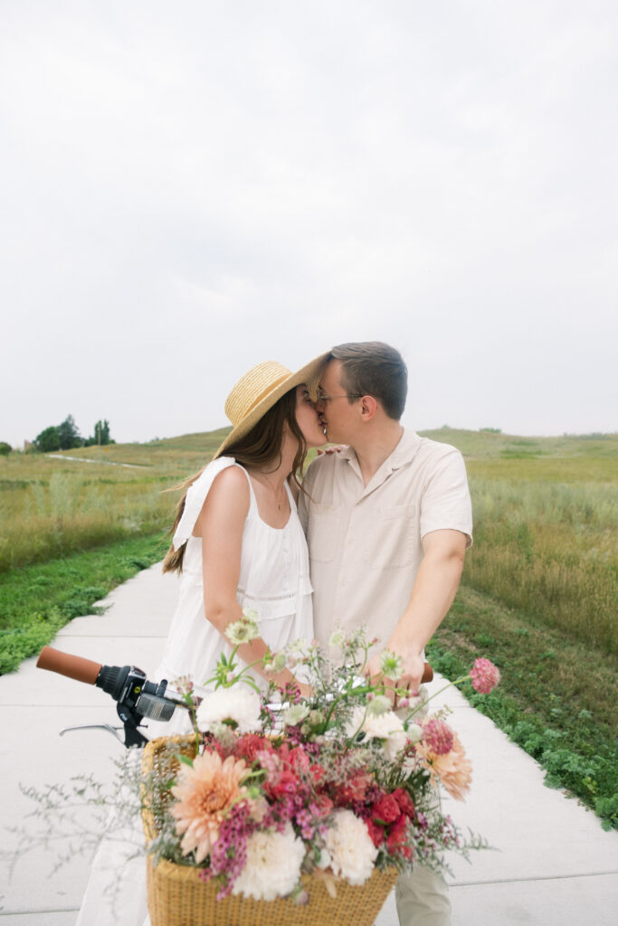 Couple kissing on a vintage bike 