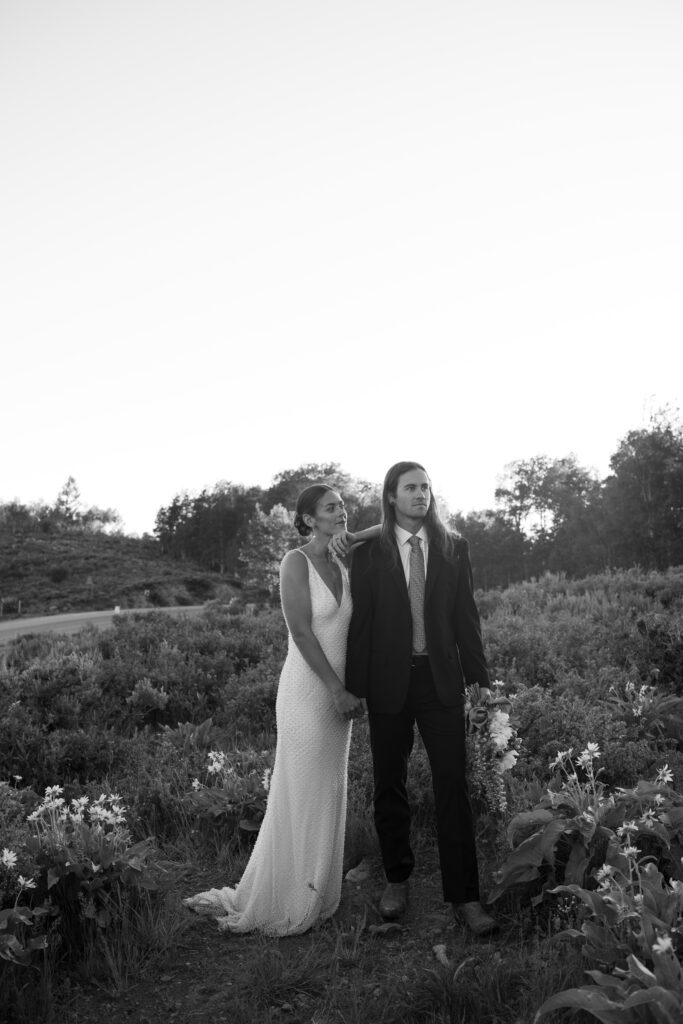 Couple posing for wedding portraits before their elopement in Grand Teton in black and white 