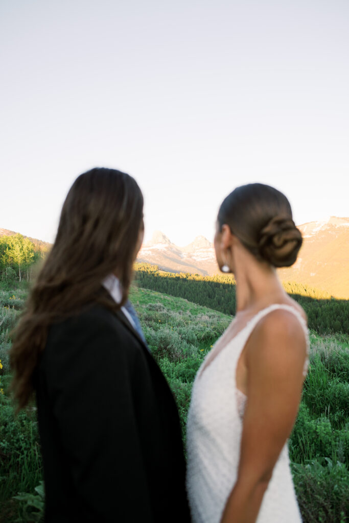 Couple looking at the Grand Teton National Park in the distance 