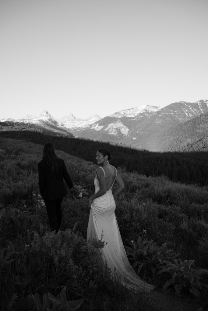 Couple walking away toward Grand Teton 