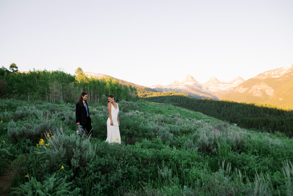 Couple posing in front of Grand Teton National Park