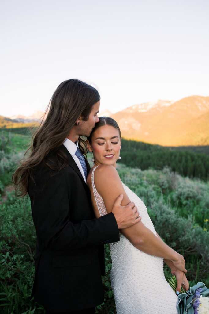 Couple posing in front of Grand Teton National Park