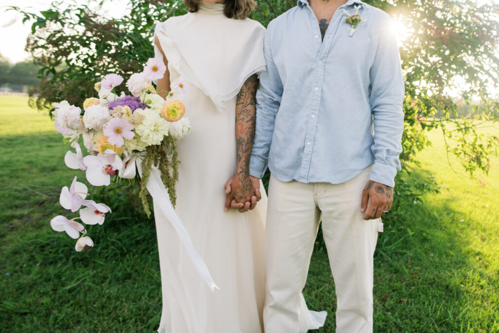 Photo of bride and groom holding hands at their post-wedding session