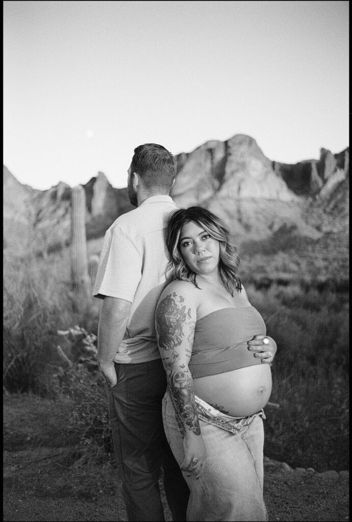 35mm film photo of a couple posing for maternity photos in the Arizona desert 