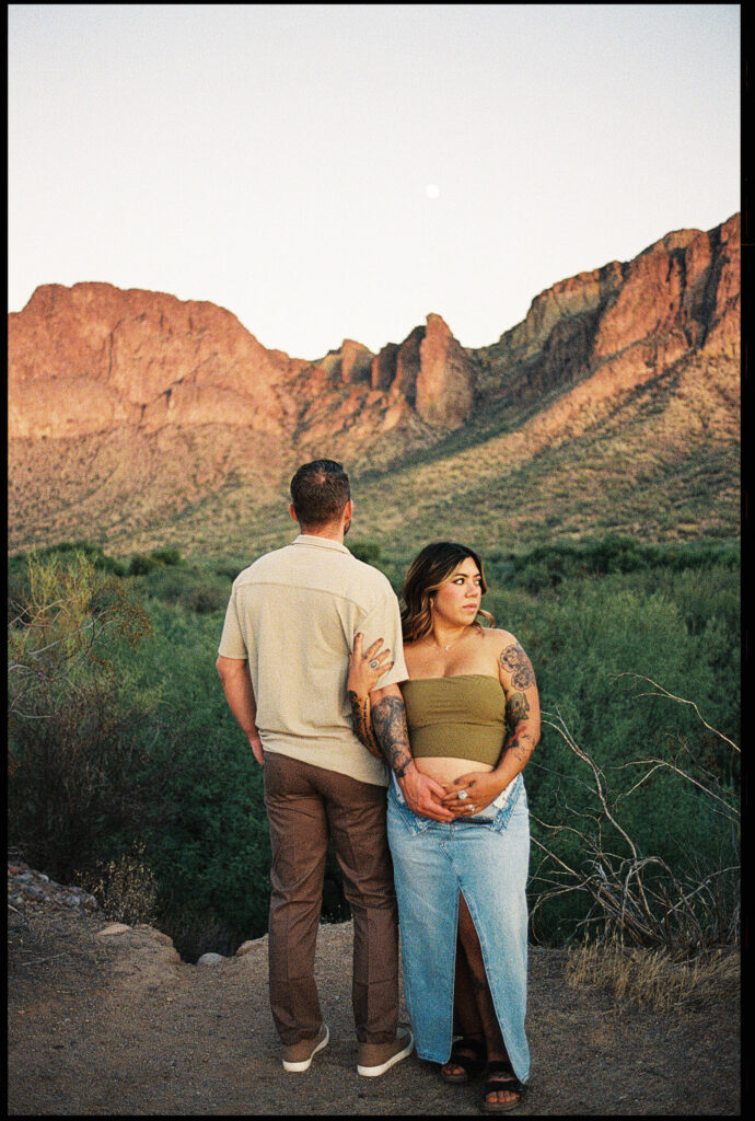 35mm film photo of a couple posing for maternity photos in the Arizona desert 