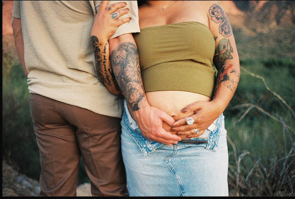 35mm film photo of a couple posing for maternity photos in the Arizona desert 