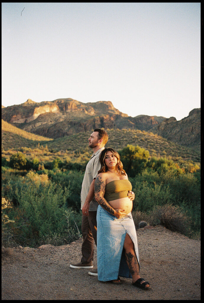 35mm film photo of a couple posing for maternity photos in the Arizona desert 