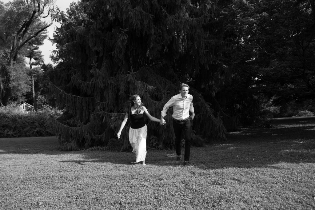 Couple posing for their engagement photos in their family backyard in Louisville, Kentucky