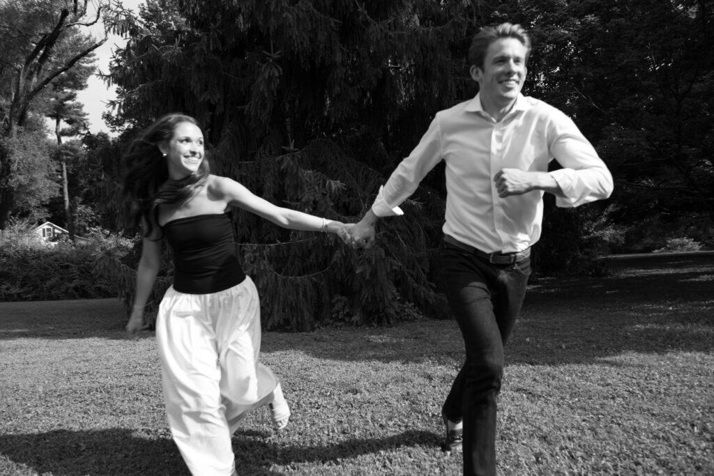 Couple posing for their engagement photos in their family backyard in Louisville, Kentucky