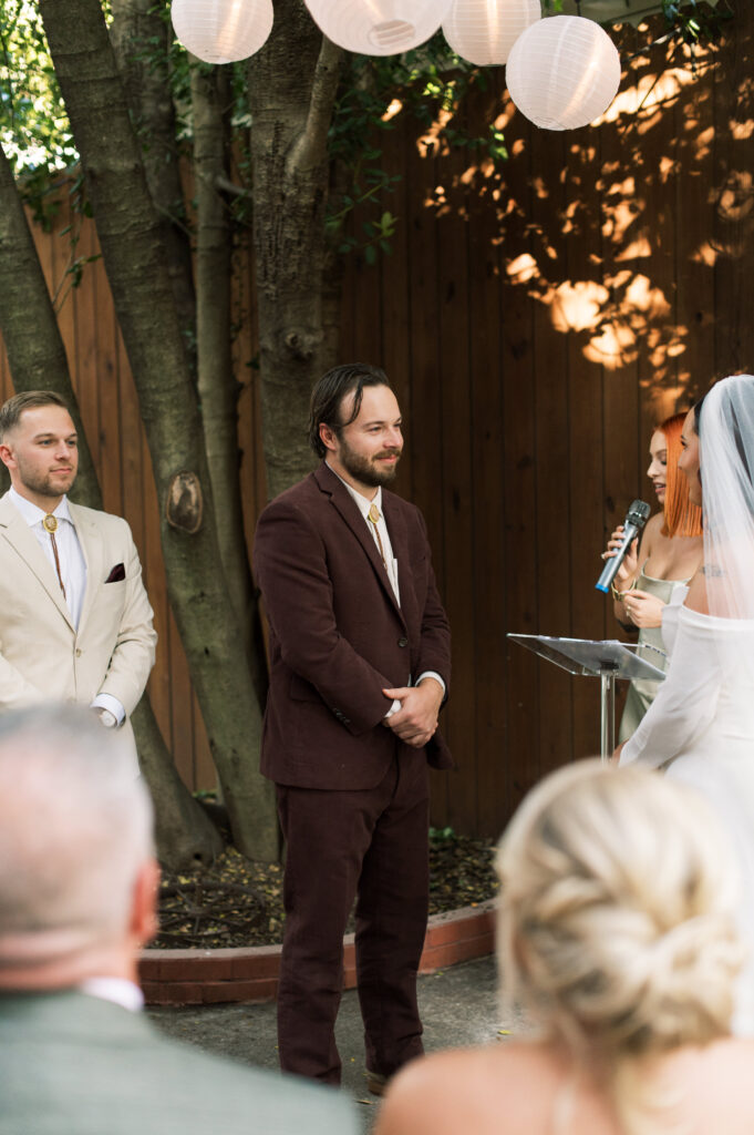 Bride and groom standing at their  intimate wedding ceremony at Urban Cowboy in Nashville, Tennessee.