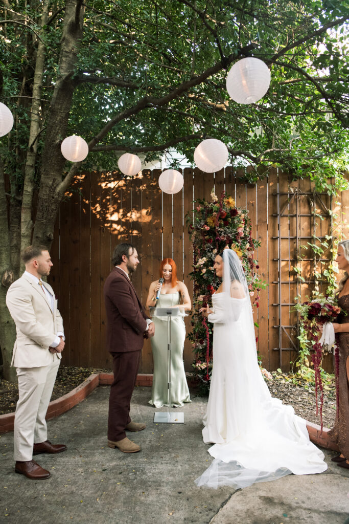 Bride and groom standing at their  intimate wedding ceremony at Urban Cowboy in Nashville, Tennessee.