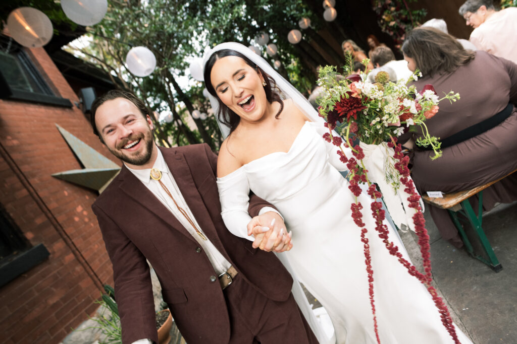 Bride and groom leaving their intimate wedding ceremony at The Urban Cowboy in Nashville, Tennessee 