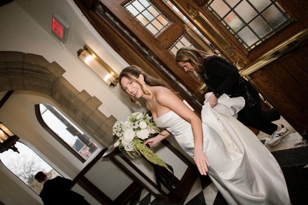 Bride walking into The Palomar to do the first look with her step-dad