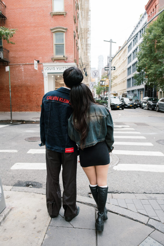 Image of couple standing on the corner in Soho