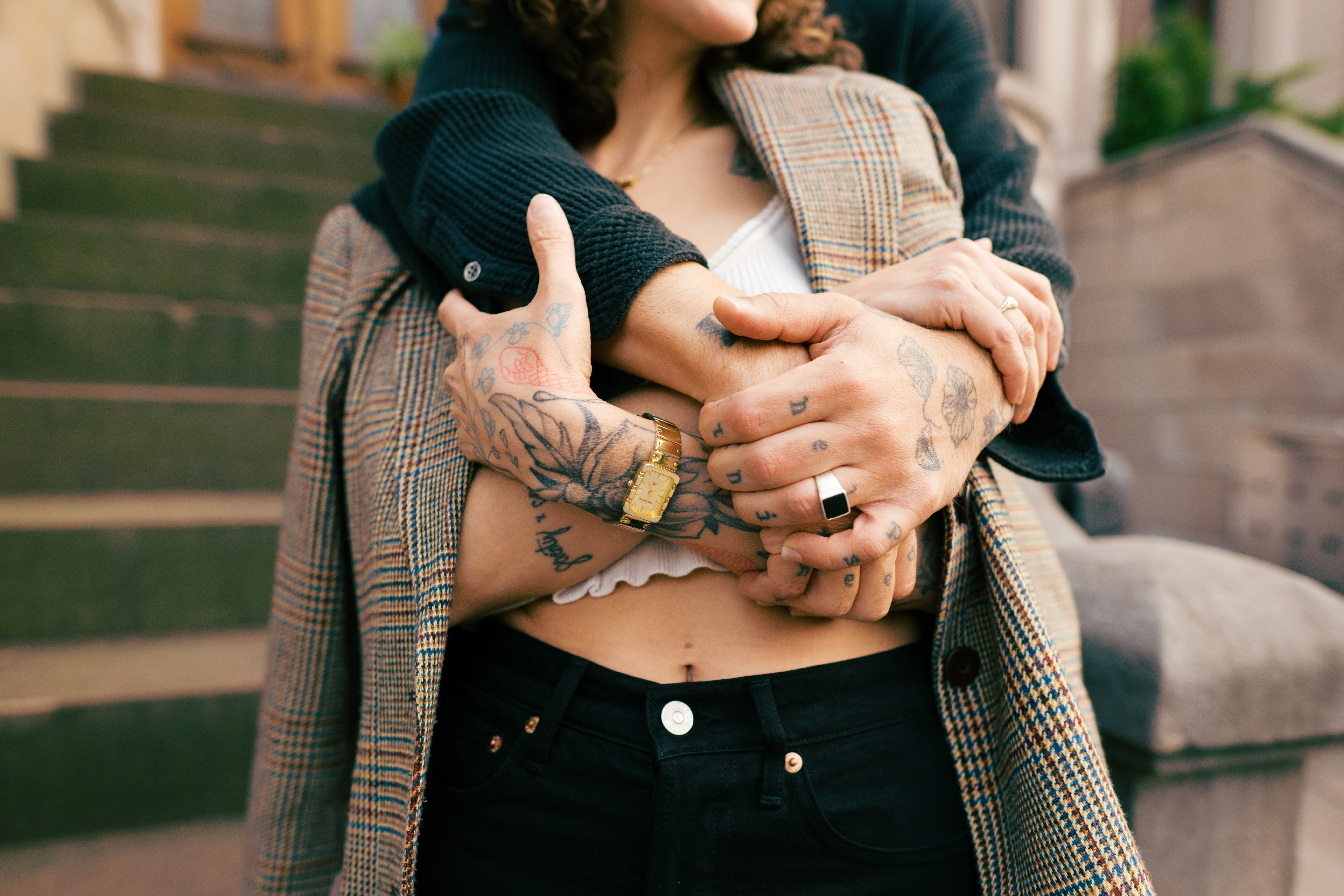 Detail image of the couples hands entangled together during their Brooklyn engagement session