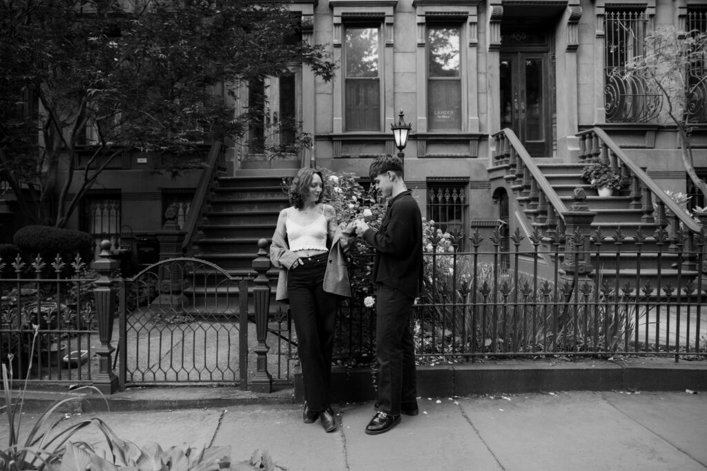 Groom admiring the brides ring during their Brooklyn engagement session in Park Slope 