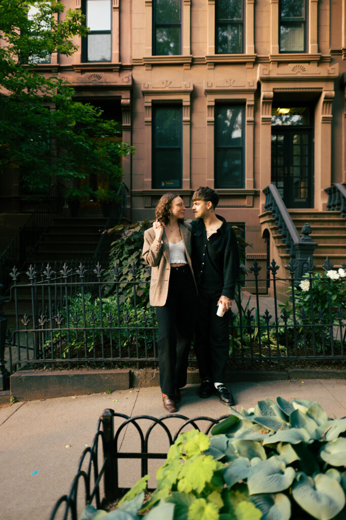 Couple posing on the streets of Brooklyn during their engagement session 