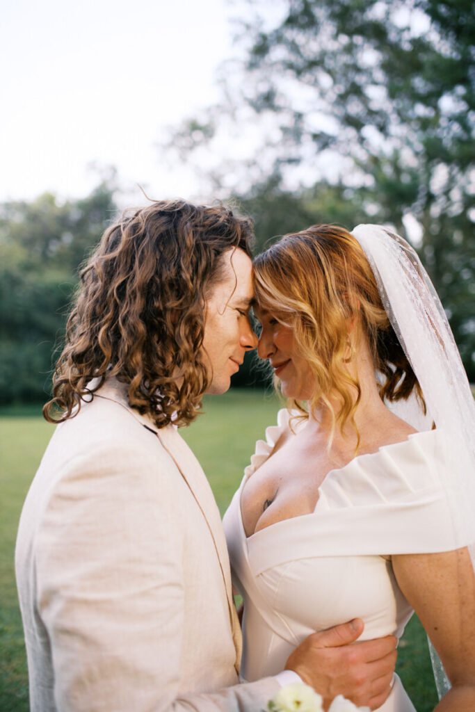 Editorial Wedding Photography shot of couple forehead to forehead smiling