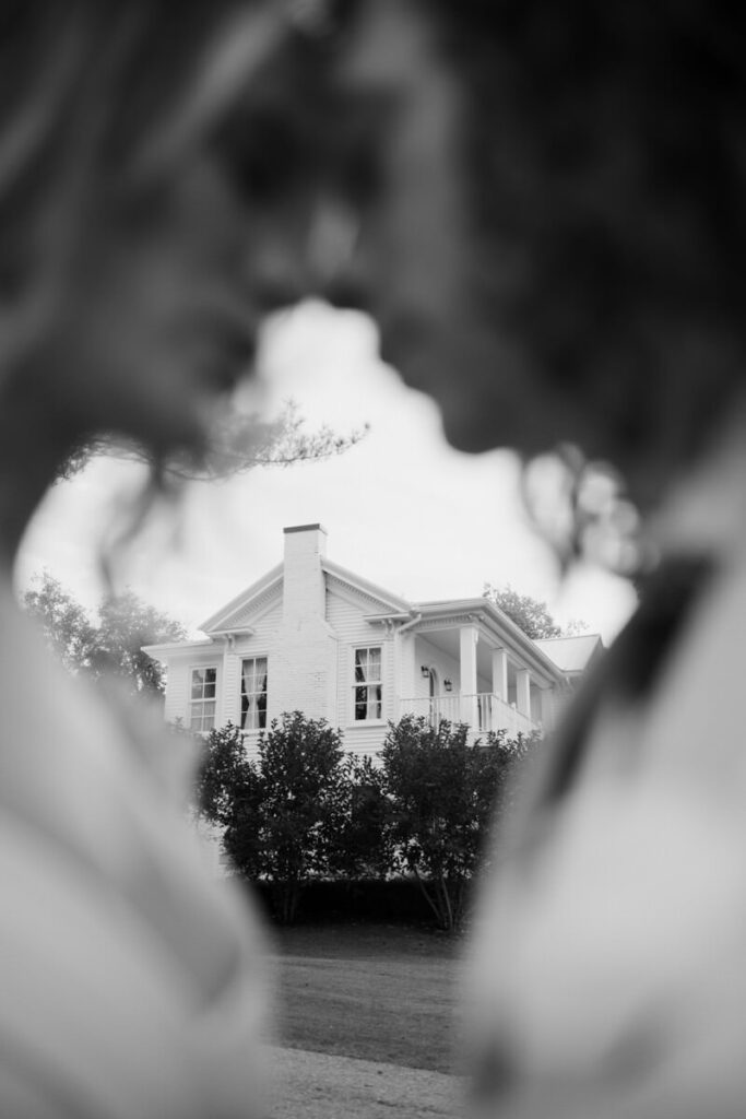 Black and white image of the wedding venue through the couple