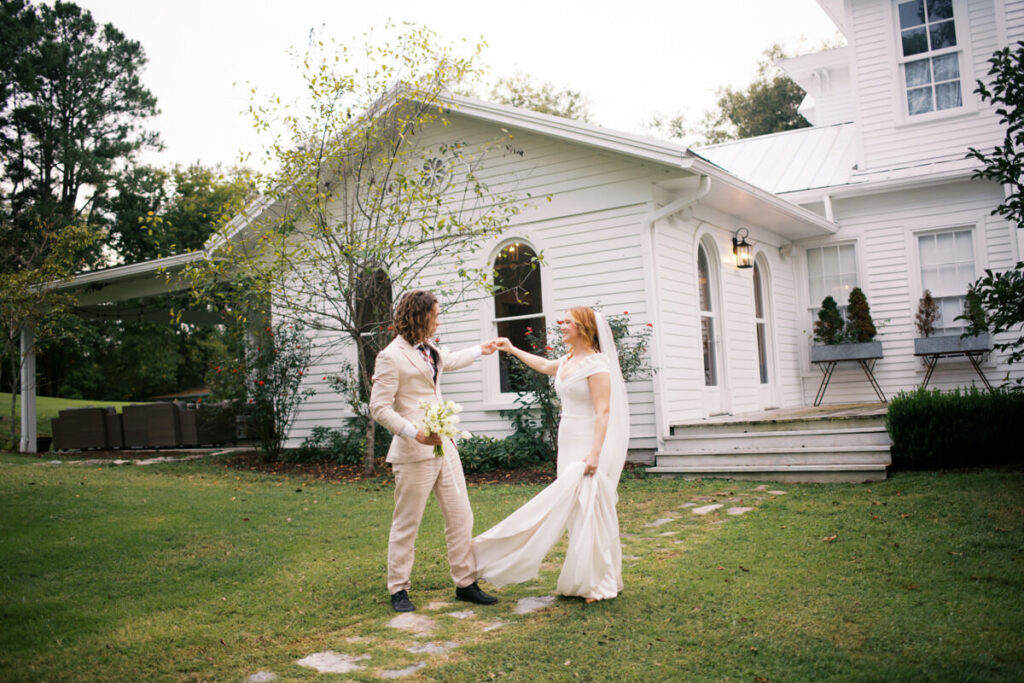 Editorial Wedding Photography of couple dancing in the front yard of their wedding venue in upstate New York