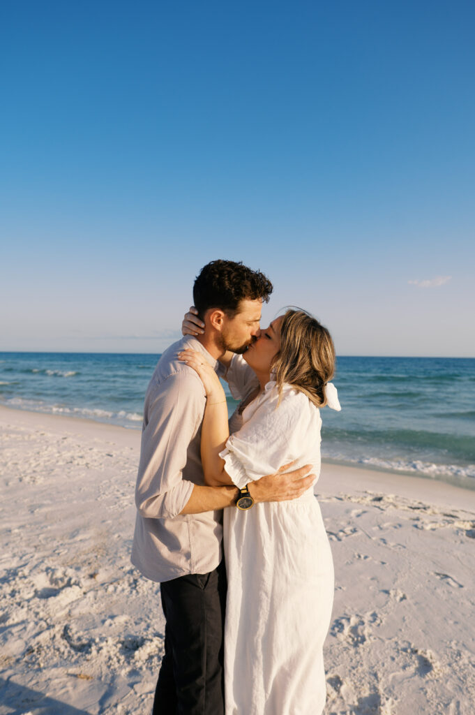 A couple kissing on the beach on the coast in Wilmington, North Carolina