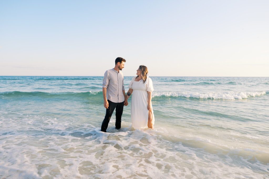 A couple kissing in the ocean on the coast in Wilmington, North Carolina