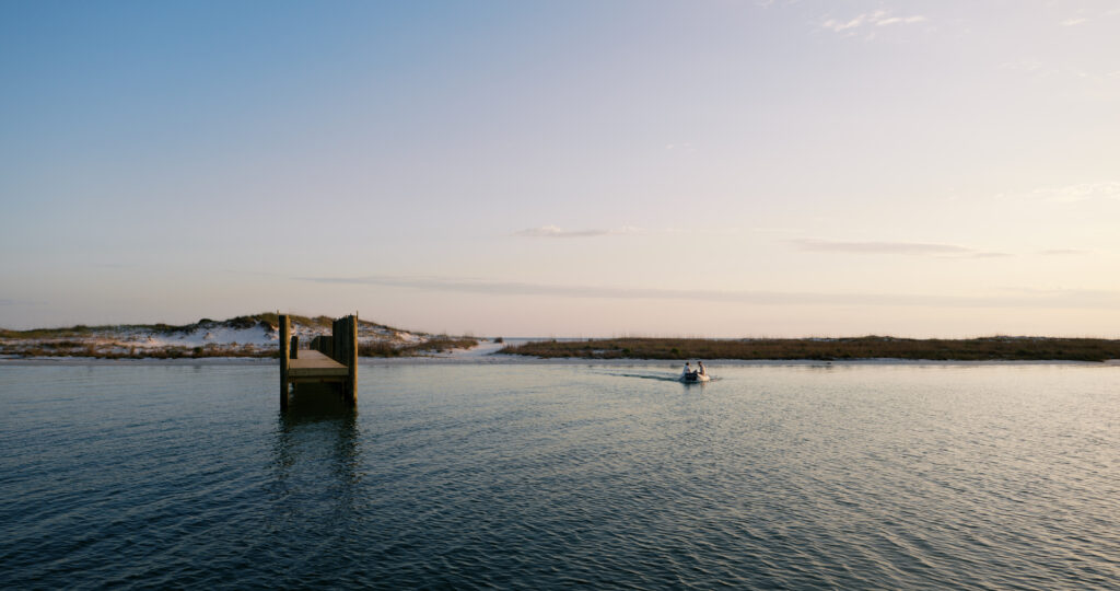 A couple on their boat back to their sailboat