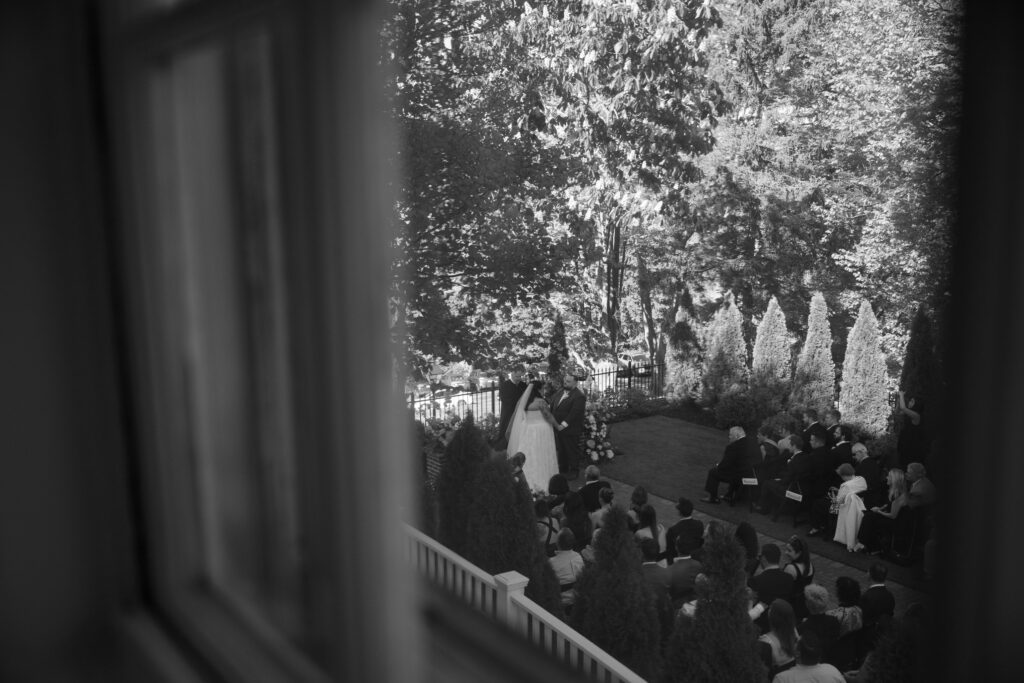 Black and white image of a couple saying their vows photographed Wilmington Wedding Photographer Bri Nicole Photo Co.