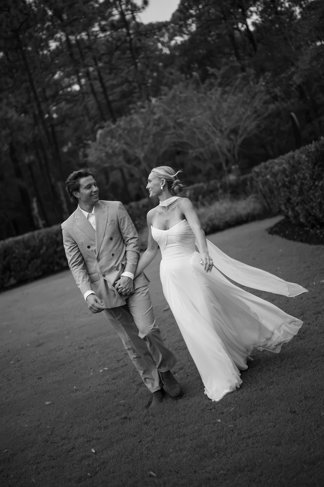Black and White image of couple walking in Wilmington, North Carolina